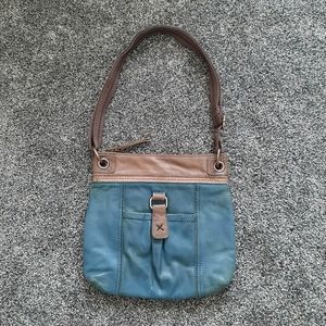 The Sak teal and taupe lined leather purse. GUC.